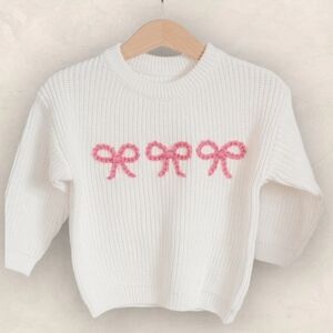 Elegant White Sweater with Pink Bow Details